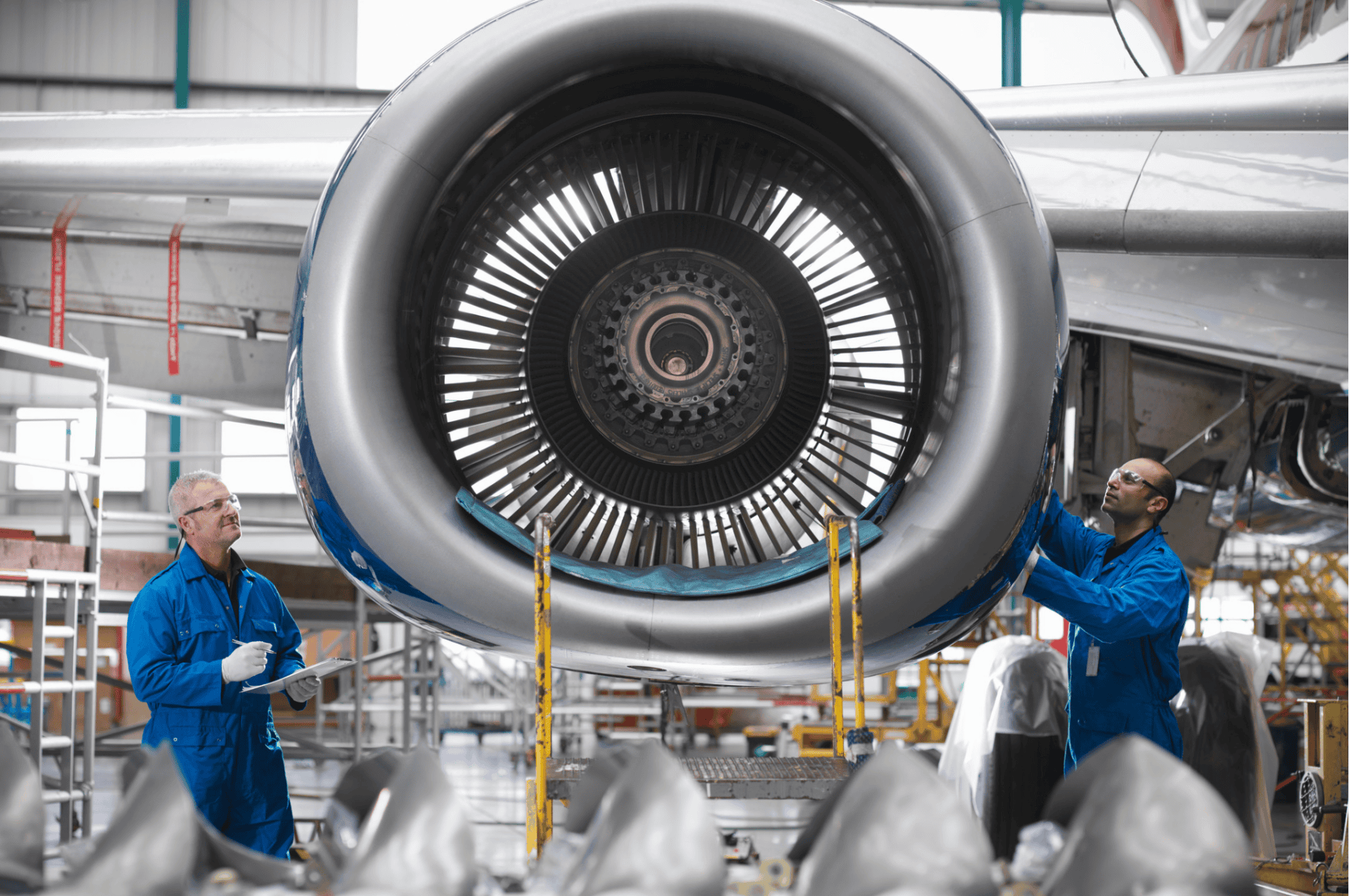 aerospace engineers working on aeroplane propeller - klinger uk