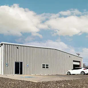 KLINGER GPI Location building with white car parked at front