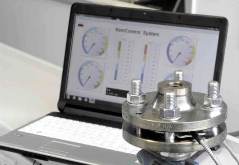 This image shows klinger united kingdom software operating KemControl system for technical support services - in front there is a flange being tested