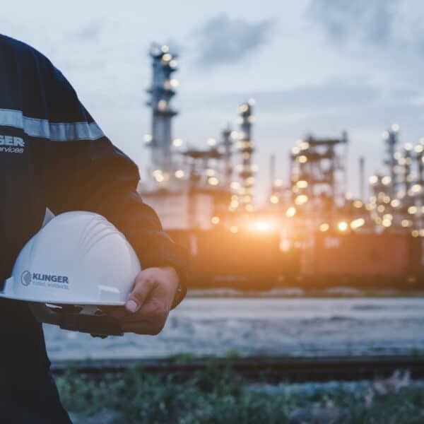 klinger united kingdom employee for integrity services on site outside chemical plant ready to operate on a flange management job