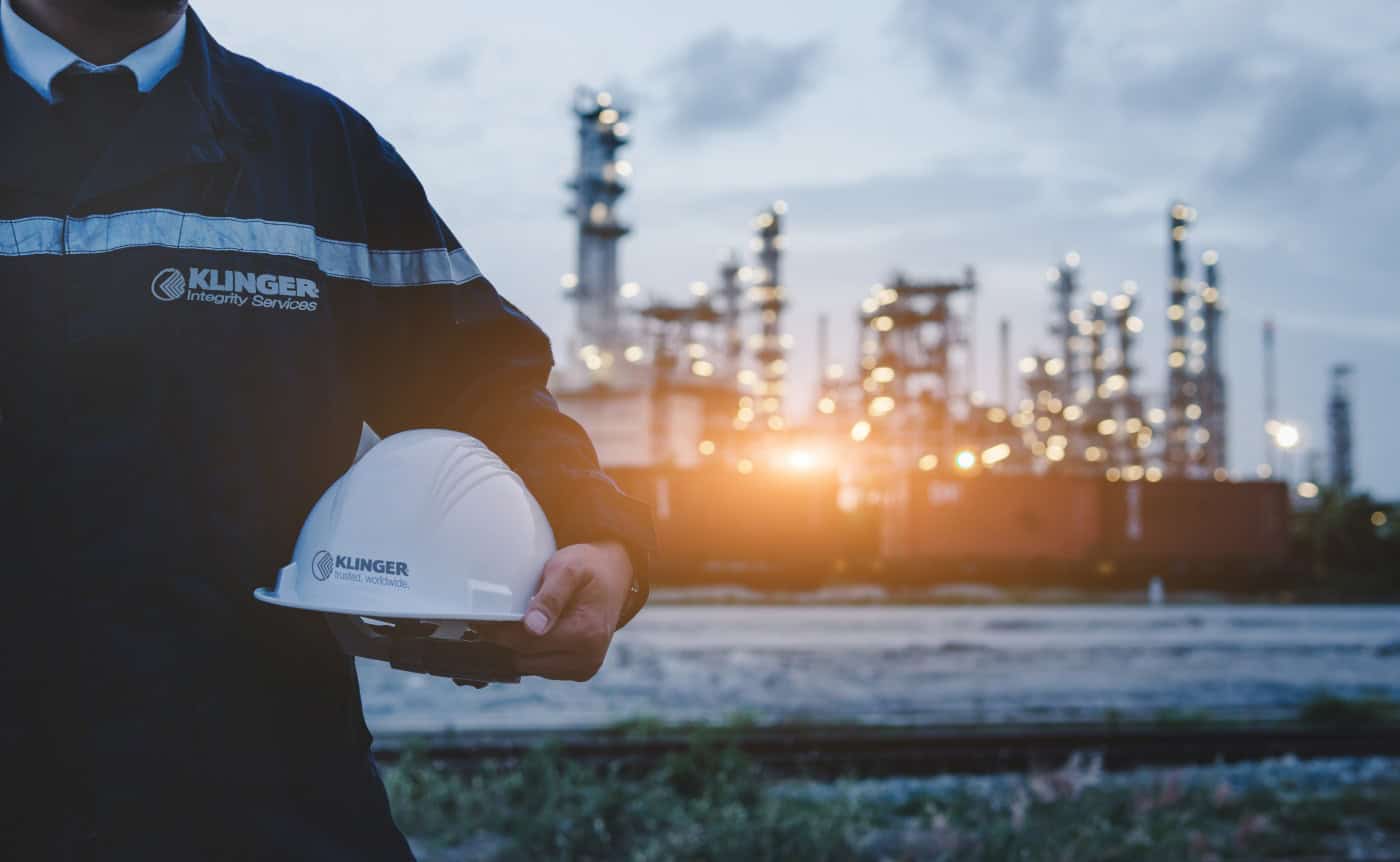 klinger united kingdom employee for integrity services on site outside chemical plant ready to operate on a flange management job