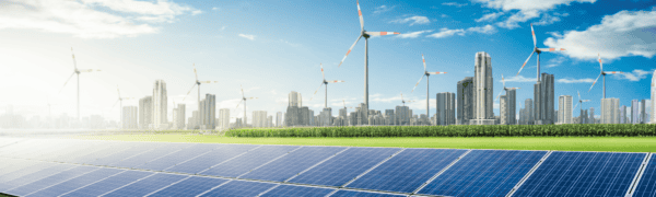 energy presentation of renewable industry presenting solar panels, grass, shrubs, wind turbines, and a city scene at rear