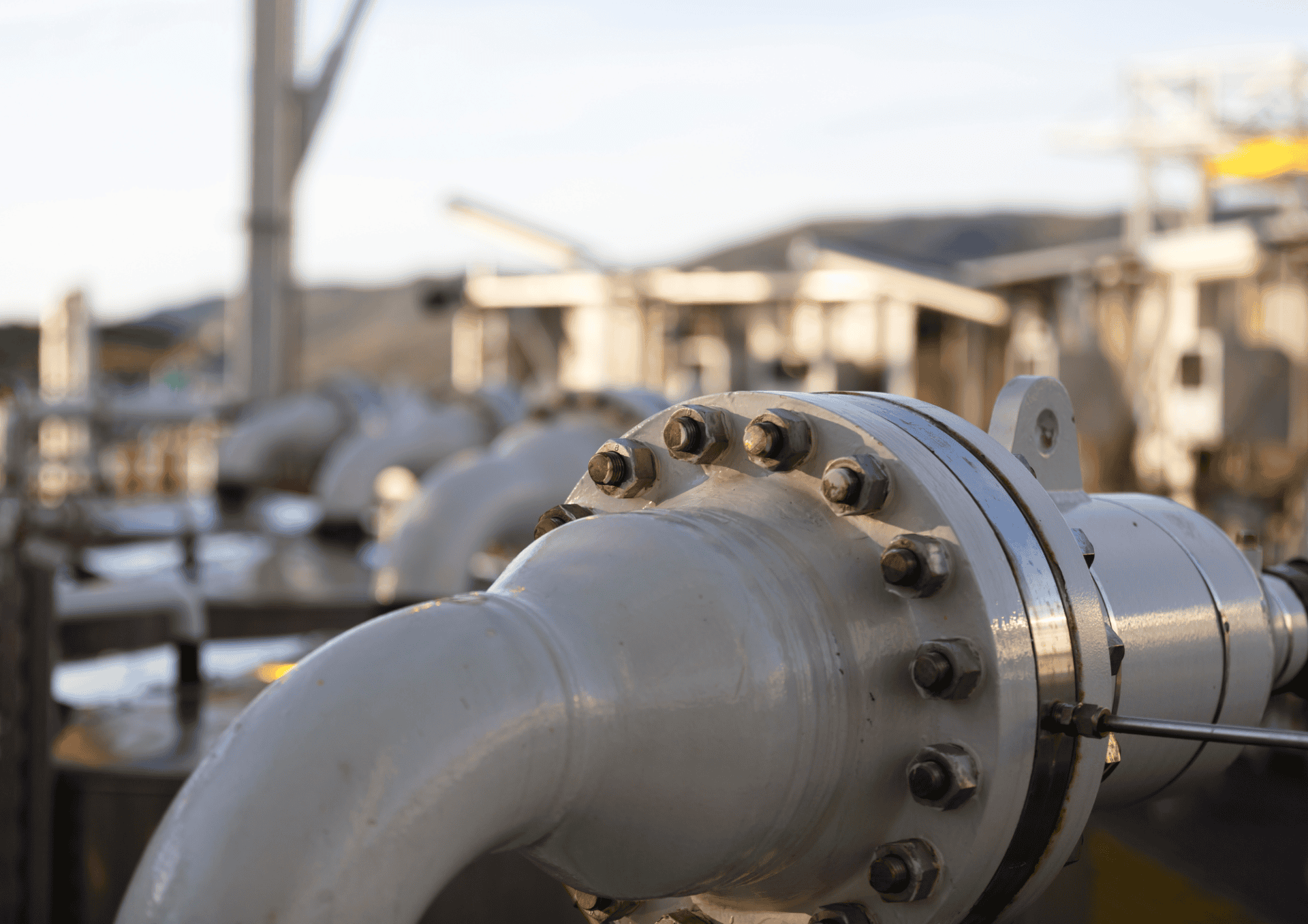 stock image of flange in industrial scene with background blurred - leak detection gasket installed klinger uk bolt torquing hero