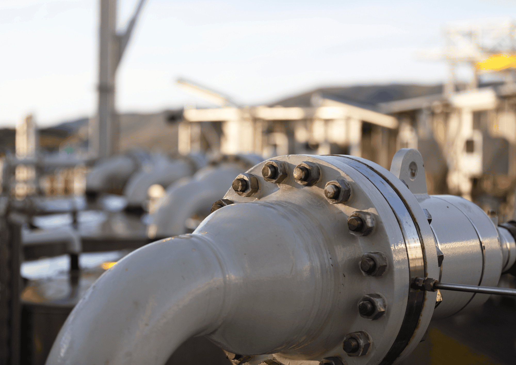 stock image of flange in industrial scene with background blurred - leak detection gasket installed klinger uk bolt torquing hero